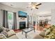 Inviting living room featuring hardwood floors, fireplace, and open floor plan to kitchen and dining areas at 5412 Emerald Spring Dr, Knightdale, NC 27545