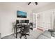 Home office with ample workspace, neutral decor, and comfortable seating area at 5412 Emerald Spring Dr, Knightdale, NC 27545