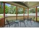 Relaxing screened-in patio with comfortable seating area overlooking fenced backyard at 5412 Emerald Spring Dr, Knightdale, NC 27545