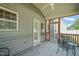 Cozy screened porch featuring a ceiling fan and outdoor seating, perfect for relaxing outdoors at 5412 Emerald Spring Dr, Knightdale, NC 27545
