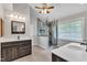 Bathroom with a walk-in shower, dual vanities, and modern fixtures, creating a spa-like atmosphere at 5521 Erinvale Ct, Holly Springs, NC 27540