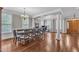Expansive dining room with high ceilings, natural light, and elegant finishes perfect for entertaining guests at 5521 Erinvale Ct, Holly Springs, NC 27540