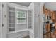 Hallway nook featuring built-in shelves, storage, and a window seat provides a functional space at 5521 Erinvale Ct, Holly Springs, NC 27540