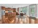 Bright kitchen with stainless steel appliances, center island, and sunny dining area creates a welcoming atmosphere at 5521 Erinvale Ct, Holly Springs, NC 27540