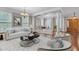 Elegant living room with stylish furnishings and ample natural light features a dedicated work space at 5521 Erinvale Ct, Holly Springs, NC 27540