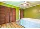 This bedroom features hardwood floors and closet storage at 5625 Church Rd, Graham, NC 27253