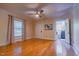 Relaxing bedroom with hardwood floors, ceiling fan, and adjacent bathroom at 5625 Church Rd, Graham, NC 27253