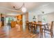Open-concept living area featuring wood floors, neutral colors, and bright lighting at 5625 Church Rd, Graham, NC 27253