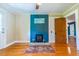 Inviting living room boasts hardwood floors and a cozy fireplace for a warm ambiance at 5625 Church Rd, Graham, NC 27253