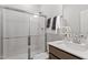 Modern bathroom with a glass-enclosed shower and a vanity with a white countertop at 60 Bold Dr, Youngsville, NC 27596