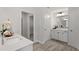 Stylish bathroom featuring double sinks, white cabinetry, and tile floors, for a spa-like experience at 60 Bold Dr, Youngsville, NC 27596