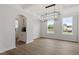 Elegant dining room with hardwood floors, coffered ceilings, and a modern chandelier at 60 Bold Dr, Youngsville, NC 27596