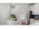 Bright kitchen with white cabinets, a kitchen island, stainless steel appliances and stylish backsplash at 60 Bold Dr, Youngsville, NC 27596