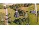 A large grassy lot features a home, outbuilding, and mature trees at 620 Richardson Rd, Zebulon, NC 27597