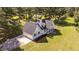 Aerial view of a well-maintained home, featuring a side-entry garage, on a large lot at 620 Richardson Rd, Zebulon, NC 27597