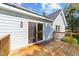 Wooden deck with sliding glass door for indoor/outdoor living and backyard access at 620 Richardson Rd, Zebulon, NC 27597
