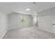Cozy bedroom with neutral walls, carpet, a modern light fixture, and bright windows at 620 Richardson Rd, Zebulon, NC 27597