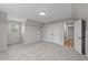 Carpeted bedroom with natural light, a double door closet and access to other rooms at 620 Richardson Rd, Zebulon, NC 27597