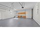 Spacious garage with built-in storage cabinets, epoxy floors, and ample lighting at 620 Richardson Rd, Zebulon, NC 27597