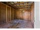 The unfinished interior of a small building shows wood stud walls and a concrete floor at 620 Richardson Rd, Zebulon, NC 27597