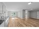 Open floor plan featuring the kitchen with wood-look floors and lots of natural light at 620 Richardson Rd, Zebulon, NC 27597