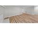 Open floor plan with updated wood-look flooring throughout the living areas at 620 Richardson Rd, Zebulon, NC 27597
