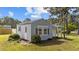 A light blue outbuilding with white trim has a small covered front porch at 620 Richardson Rd, Zebulon, NC 27597
