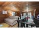 Cozy attic featuring wood paneling, natural light, plush seating, and play areas for  at 6447 Beulah Church Rd, Liberty, NC 27298