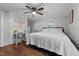Bedroom with a large bed, a ceiling fan and desk area with lots of natural light at 6447 Beulah Church Rd, Liberty, NC 27298