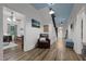 Hallway with a blue ceiling, shiplap walls, and hardwood floors with view to formal living room at 6447 Beulah Church Rd, Liberty, NC 27298