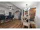Bright kitchen boasts wood accents, white cabinets, stainless steel appliances, and an eat-in dining area at 6447 Beulah Church Rd, Liberty, NC 27298