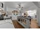 Well-lit kitchen featuring butcher block island, white cabinets, and stainless steel appliances at 6447 Beulah Church Rd, Liberty, NC 27298