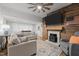 Bright living room with wood accent wall, fireplace, and comfortable seating at 6447 Beulah Church Rd, Liberty, NC 27298