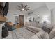 Open living room with fireplace, modern furniture, and view of the kitchen at 6447 Beulah Church Rd, Liberty, NC 27298