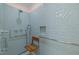 Modern bathroom showcasing a blue tile walk-in shower with a built-in wooden seat at 6925 Valley Lake Dr, Raleigh, NC 27612