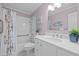 Clean, well-maintained bathroom with a white vanity, updated fixtures, and shower at 6925 Valley Lake Dr, Raleigh, NC 27612