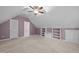 Spacious bonus room with carpet, built-in shelving, and access to additional rooms at 6925 Valley Lake Dr, Raleigh, NC 27612