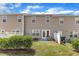 Backyard with a small patio, well-maintained lawn, and privacy fence for outdoor enjoyment at 711 Keystone Park Dr # 7, Morrisville, NC 27560