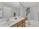 Bright bathroom with double sink vanity, large mirror, and a shower-tub combo with white tile surround at 711 Keystone Park Dr # 7, Morrisville, NC 27560