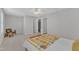 Spacious primary bedroom boasts a ceiling fan and plush carpet, leading into the ensuite bathroom through an open doorway at 711 Keystone Park Dr # 7, Morrisville, NC 27560