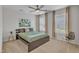 Bright bedroom featuring a ceiling fan, plush carpet, and large windows for ample natural light at 711 Keystone Park Dr # 7, Morrisville, NC 27560