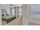 Bright bedroom featuring a ceiling fan, plush carpet, and large windows for ample natural light at 711 Keystone Park Dr # 7, Morrisville, NC 27560