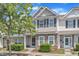 Attractive exterior elevation showcasing a two-story townhome with well-kept landscaping at 711 Keystone Park Dr # 7, Morrisville, NC 27560