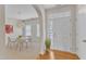 Welcoming foyer with hardwood floors leading into a bright dining area and adjacent rooms at 711 Keystone Park Dr # 7, Morrisville, NC 27560