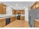 Spacious kitchen with wooden cabinets, modern appliances, and ample counter space at 711 Keystone Park Dr # 7, Morrisville, NC 27560