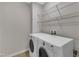Bright laundry room featuring shelving and modern, front-loading washer and dryer units at 711 Keystone Park Dr # 7, Morrisville, NC 27560