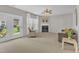 Cozy living room with fireplace and access to the backyard through glass doors at 711 Keystone Park Dr # 7, Morrisville, NC 27560