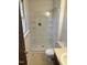 Bright bathroom featuring a tiled shower, classic toilet, and vanity with neutral countertop and flooring at 713 Marlboro Pl, Rocky Mount, NC 27801