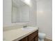 Clean bathroom with white tile, classic fixtures, and a vanity with storage at 713 Marlboro Pl, Rocky Mount, NC 27801