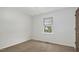 Cozy bedroom with neutral carpet, white walls, and natural light from the window at 713 Marlboro Pl, Rocky Mount, NC 27801